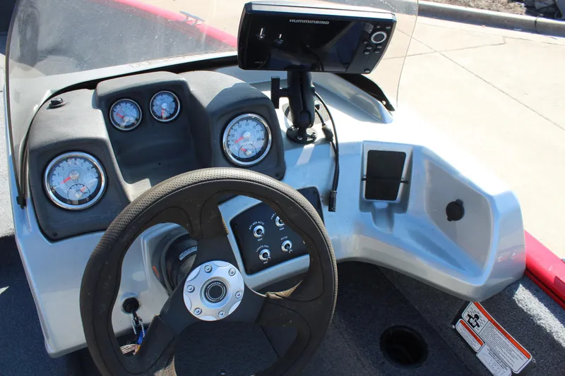 Slide: The Image of 2018 Tracker Pro Guide V-175 SC dashboard with steering wheel and electronic display. - 16