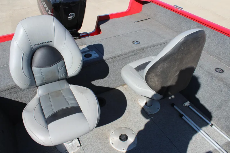 Slide: The Image of 2018 Tracker Pro Guide V-175 SC boat interior with two gray seats. - 17