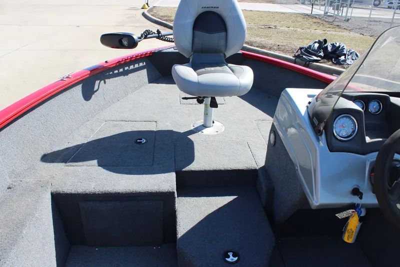 Slide: The Image of 2018 Tracker Pro Guide V-175 SC boat interior with seating and control panel. - 18