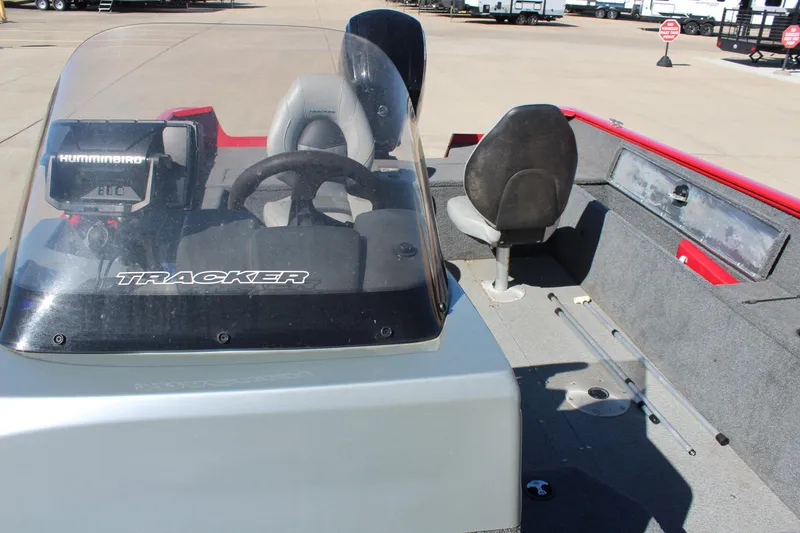 Slide: The Image of 2018 Tracker Pro Guide V-175 SC boat interior with steering console and seating. - 23