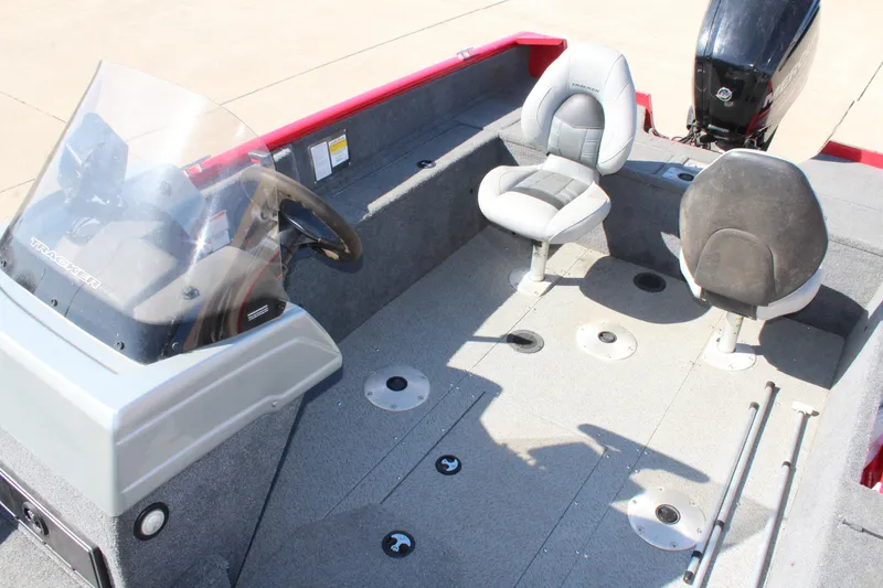 Slide: The Image of 2018 Tracker Pro Guide V-175 SC boat interior with seating and steering console. - 25
