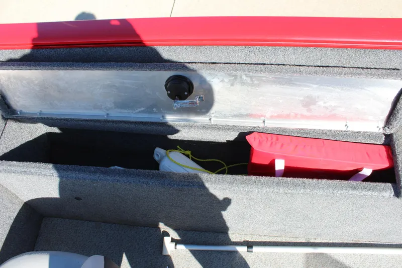 Slide: The Image of 2018 Tracker Pro Guide V-175 SC storage compartment with red and gray interior. - 29