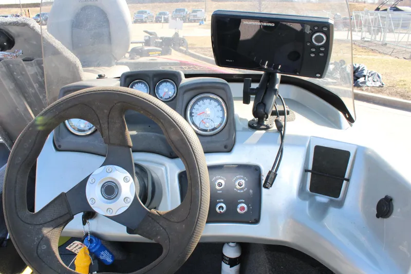 Slide: The Image of 2018 Tracker Pro Guide V-175 SC dashboard with steering wheel, gauges, and fishfinder. - 35