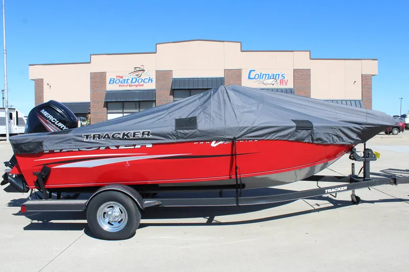 Slide: The Image of 2018 Tracker Pro Guide V-175 SC boat with cover, parked outside dealership. - 41