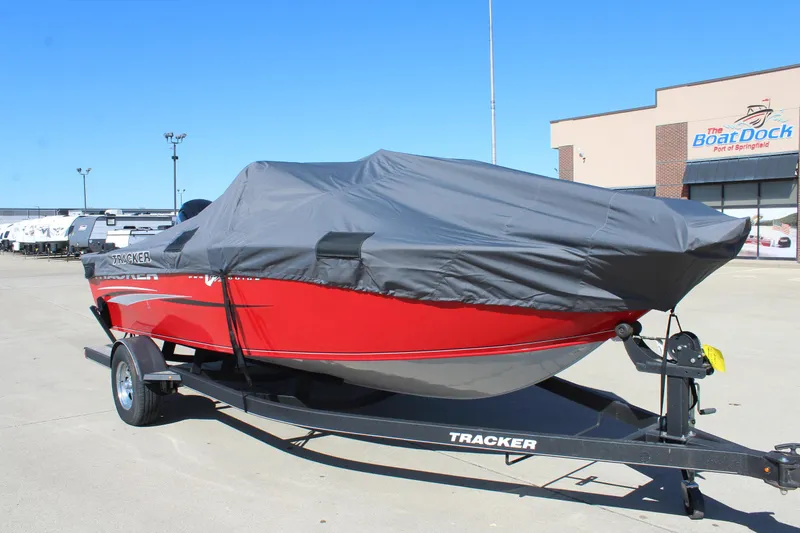 Slide: The Image of 2018 Tracker Pro Guide V-175 SC boat covered on trailer, parked outside dealership. - 42
