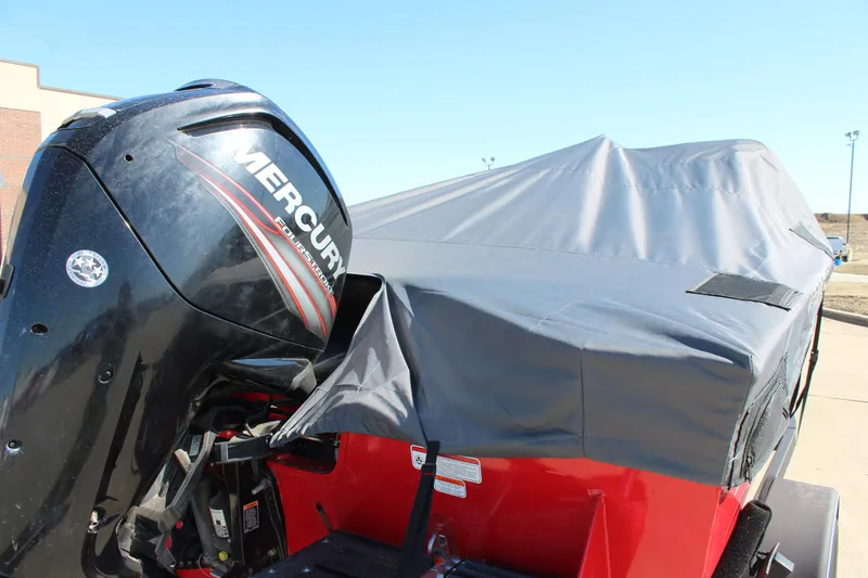 Slide: The Image of 2018 Tracker Pro Guide V-175 SC boat with Mercury engine, covered and parked outdoors. - 46