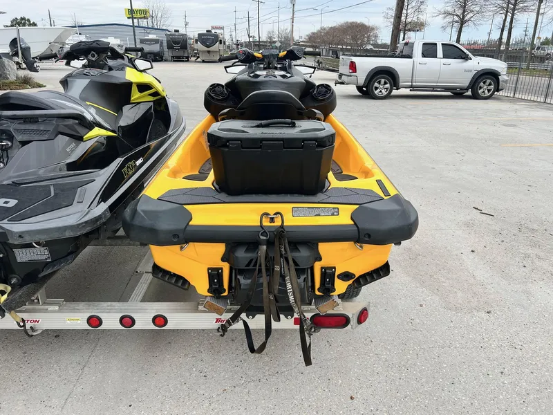 Slide: The Image of 2021 Sea-Doo RXP-X 300 jet ski on trailer, parked in lot. - 4