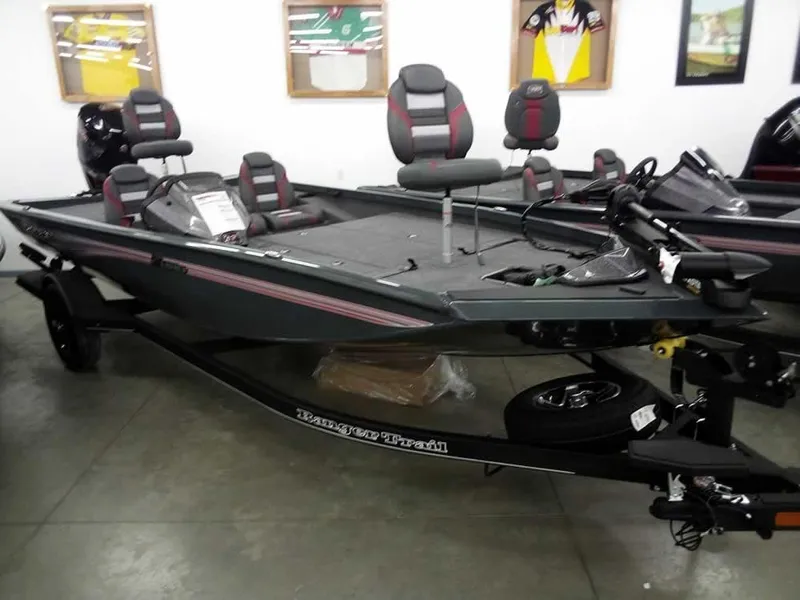 The Image of 2025 Ranger RT188P fishing boat displayed indoors, featuring modern seating and equipment. - 1