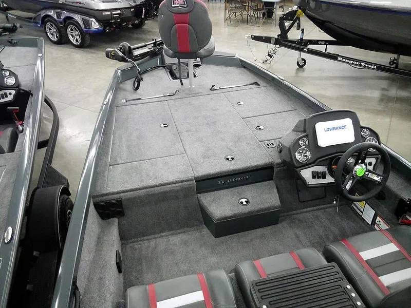 Slide: The Image of 2025 Ranger RT188P fishing boat interior with steering console and seating. - 10
