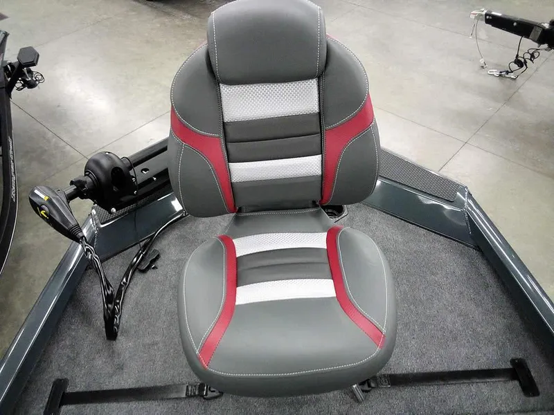 Slide: The Image of 2025 Ranger RT188P boat seat with gray, red, and white design on a carpeted deck. - 16
