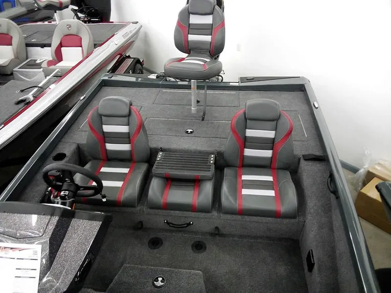 Slide: The Image of 2025 Ranger RT188P boat interior with gray and red seating. - 19