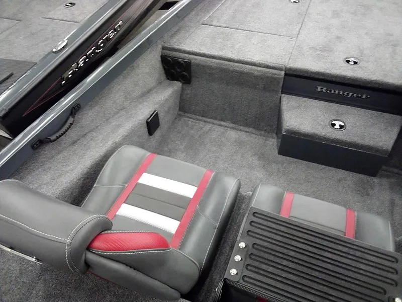 Slide: The Image of 2025 Ranger RT188P boat interior with gray and red seating. - 21
