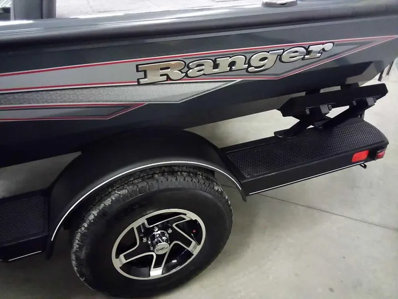 Slide: The Image of 2025 Ranger RT188P boat trailer with branded side panel and wheel detail. - 6