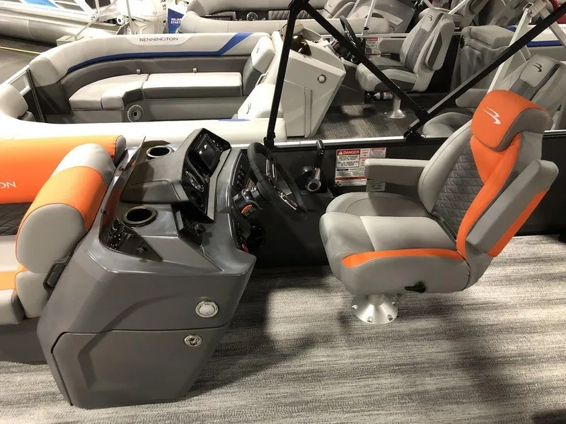 Slide: The Image of 2025 Bennington S L-Bench 23 SL boat interior with modern helm and seating. - 3