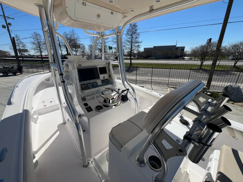 Slide: The Image of 2009 Ocean Runner 29 cc boat cockpit with steering wheel and navigation equipment. - 10