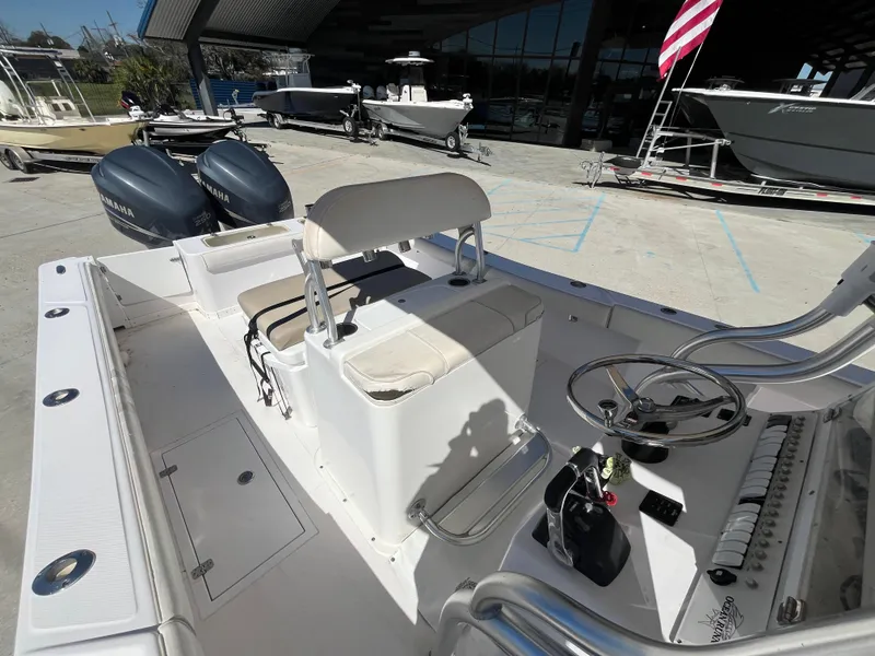 Slide: The Image of 2009 Ocean Runner 29 cc boat interior with dual engines and steering console. - 11