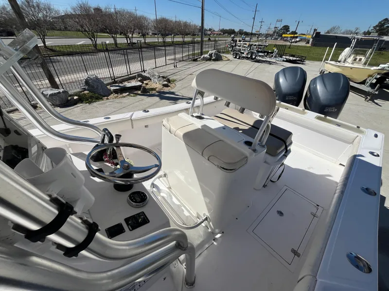 Slide: The Image of 2009 Ocean Runner 29 cc boat interior with dual engines and steering console. - 15