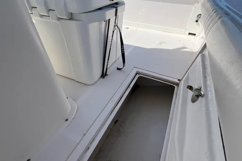 Slide: The Image of 2009 Ocean Runner 29 cc boat interior with storage compartment and seating. - 22