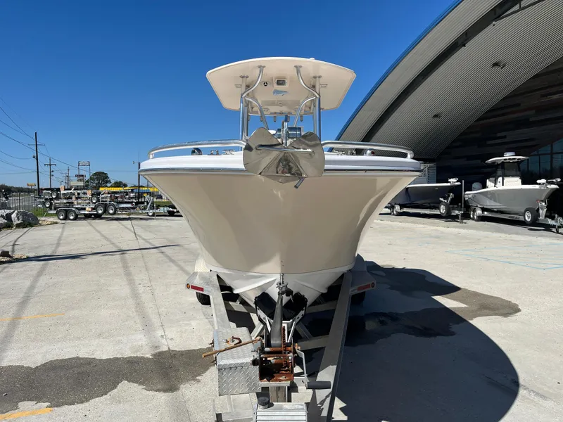 Slide: The Image of 2009 Ocean Runner 29 cc boat on trailer, parked outdoors near a large building. - 3