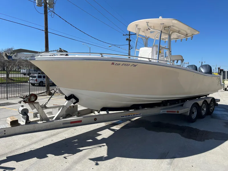Slide: The Image of 2009 Ocean Runner 29 cc boat on trailer under clear blue sky. - 4