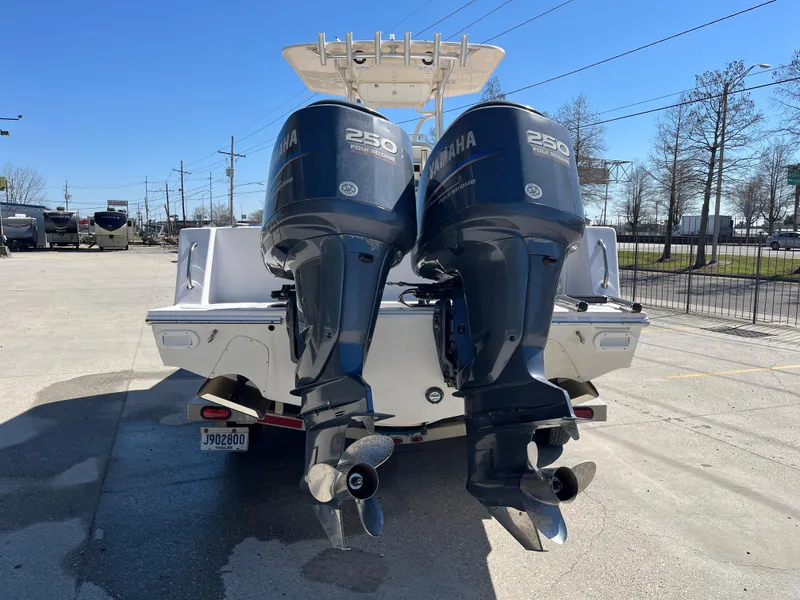 Slide: The Image of 2009 Ocean Runner 29 cc boat with dual Yamaha 250 engines, parked outdoors. - 7