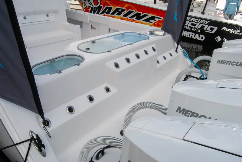 Slide: The Image of 2025 Front Runner 43 Catamaran with Mercury engines and sleek design features. - 10