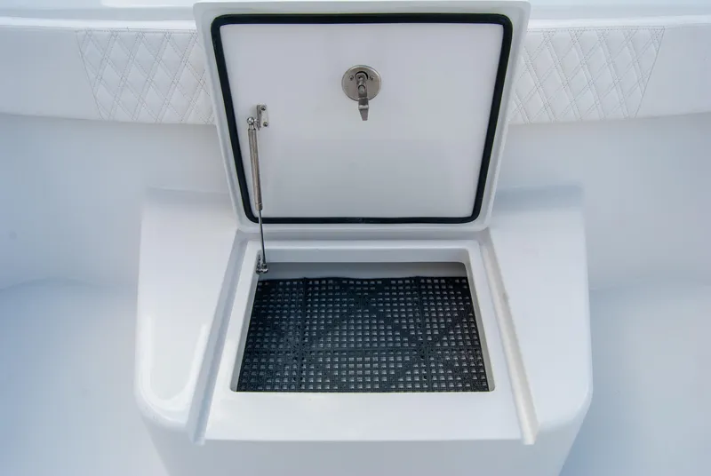 Slide: The Image of 2025 Front Runner 43 Catamaran storage compartment with open lid and secure latch. - 19