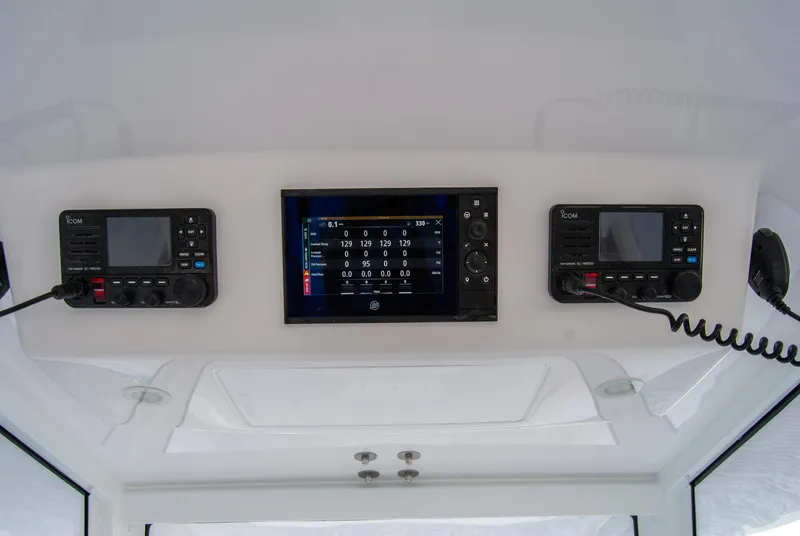Slide: The Image of 2025 Front Runner 43 Catamaran dashboard with advanced navigation and communication systems. - 21