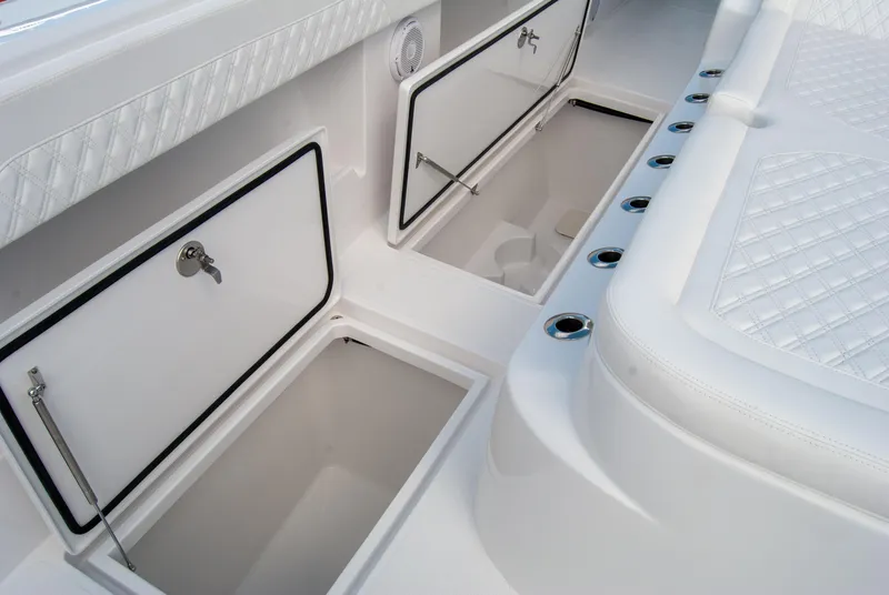 Slide: The Image of 2025 Front Runner 43 Catamaran storage compartments and seating detail. - 24