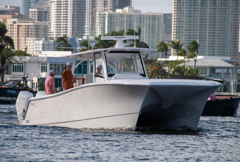 Slide: The Image of 2025 Front Runner 43 Catamaran cruising in urban waterfront setting. - 29