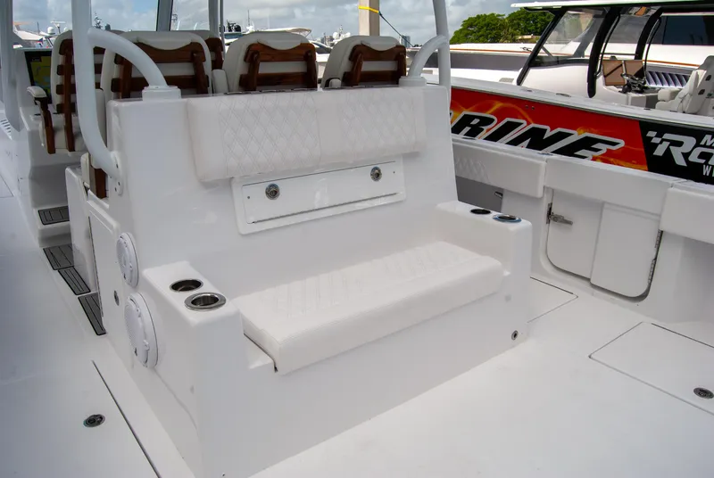 Slide: The Image of 2025 Front Runner 43 Catamaran interior with white seating and cup holders. - 33