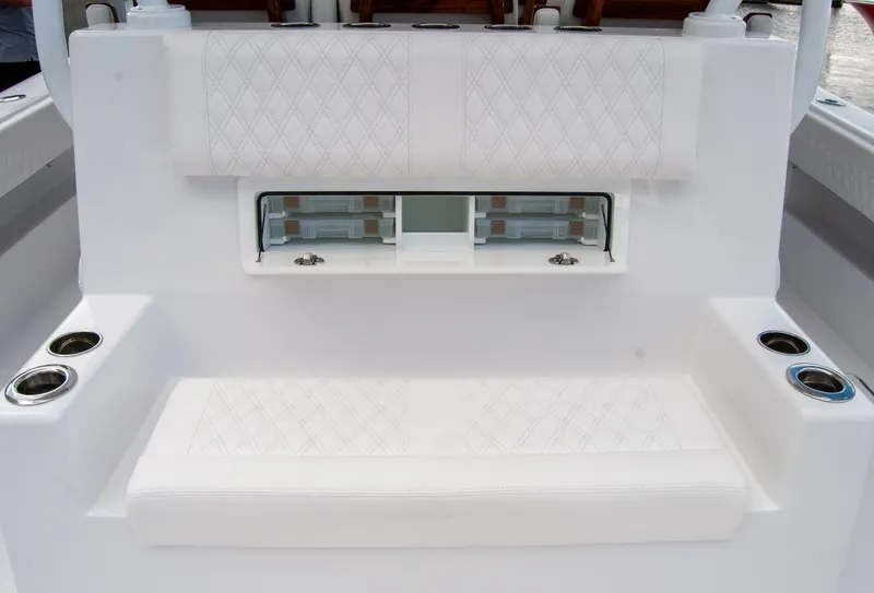 Slide: The Image of Luxury seating area on 2025 Front Runner 43 Catamaran with cup holders and storage. - 35