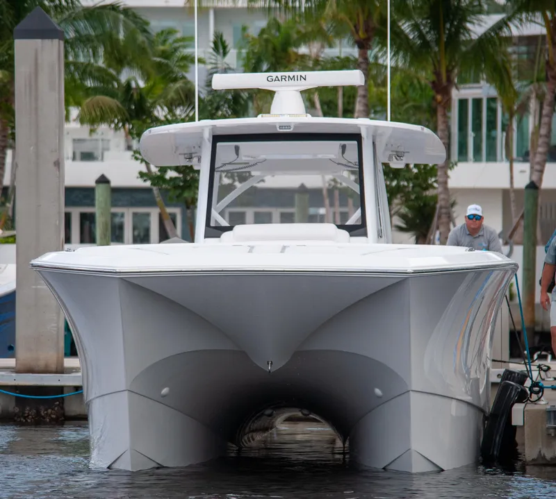 Slide: The Image of 2025 Front Runner 43 Catamaran docked, featuring sleek design and Garmin equipment. - 4