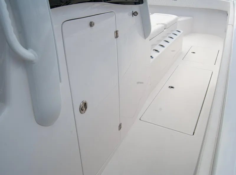 Slide: The Image of 2025 Front Runner 43 Catamaran interior with sleek white storage compartments. - 41