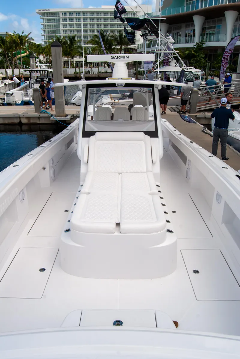 Slide: The Image of 2025 Front Runner 43 Catamaran docked at marina, showcasing spacious deck and modern design. - 44