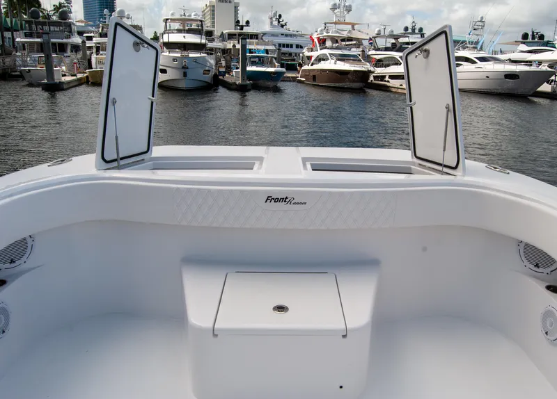 Slide: The Image of 2025 Front Runner 43 Catamaran docked at marina, open storage compartments visible. - 45