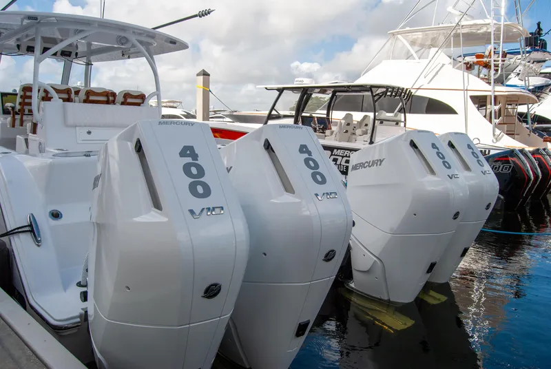 Slide: The Image of 2025 Front Runner 43 Catamaran with four Mercury 400 V10 engines docked at marina. - 5