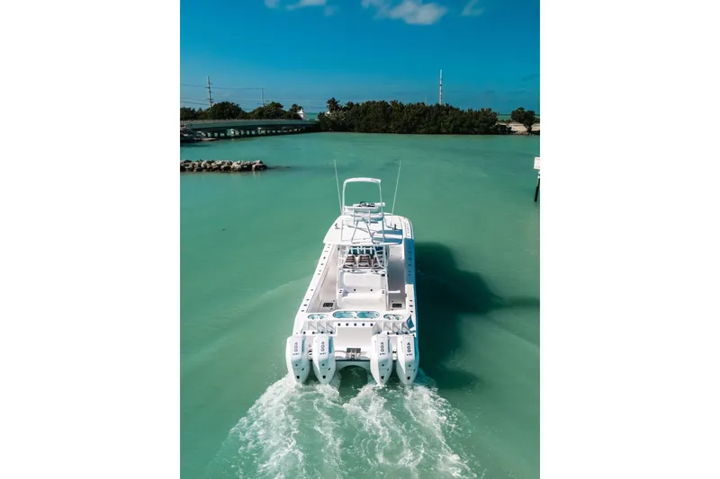 Slide: The Image of Front Runner 43 Catamaran 2026 cruising in turquoise waters under a clear blue sky. - 64