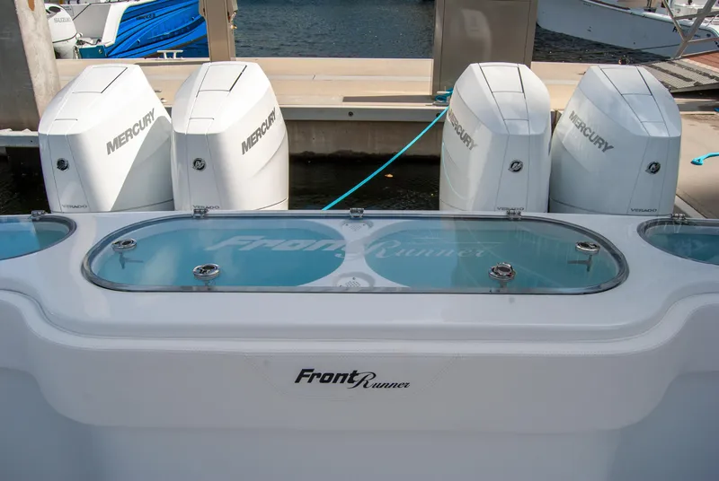 Slide: The Image of 2025 Front Runner 43 Catamaran with four Mercury outboard engines at dock. - 7