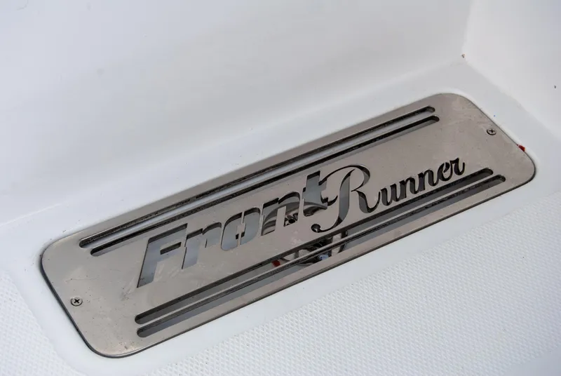 Slide: The Image of Front Runner 43 Catamaran 2025 logo on metallic surface. - 8