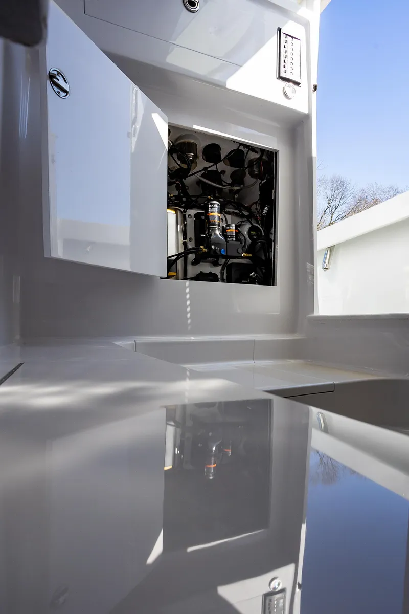 Slide: The Image of Engine compartment of 2005 French Yachts 34 Center Console, showcasing interior details. - 16