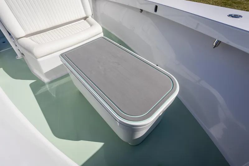 Slide: The Image of 2005 French Yachts 34 Center Console interior with cushioned seating and sleek design. - 18