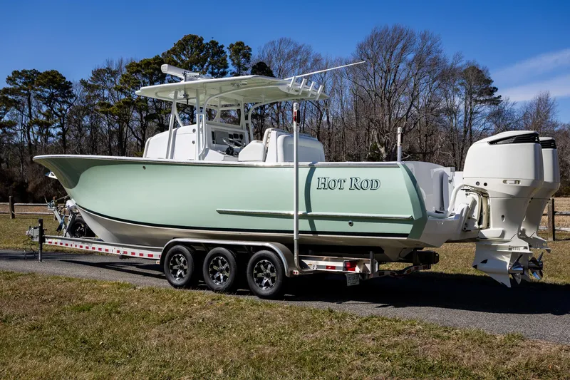 Slide: The Image of 2005 French Yachts 34 Center Console on trailer, parked outdoors. - 2