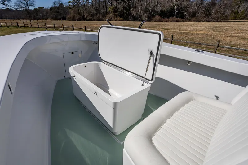 Slide: The Image of 2005 French Yachts 34 Center Console with open storage compartment on deck. - 20