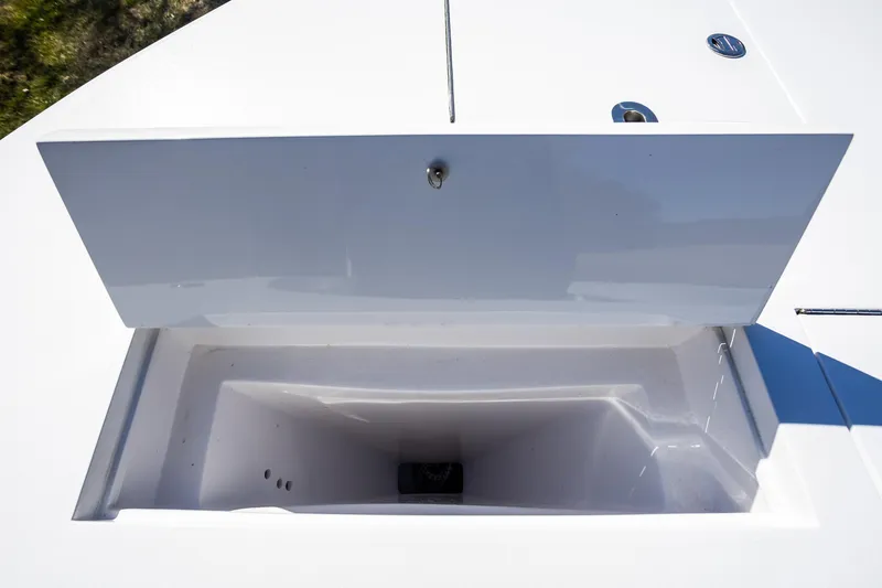 Slide: The Image of Open storage compartment on 2005 French Yachts 34 Center Console boat. - 24