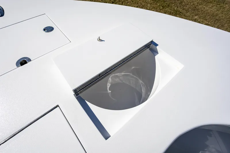 Slide: The Image of 2005 French Yachts 34 Center Console deck detail with storage compartment. - 25
