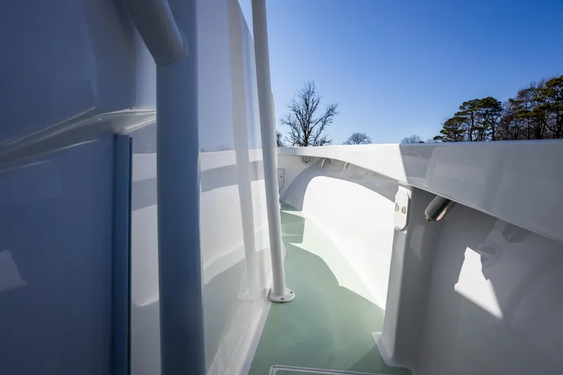 Slide: The Image of 2005 French Yachts 34 Center Console, sleek white deck, clear blue sky background. - 29