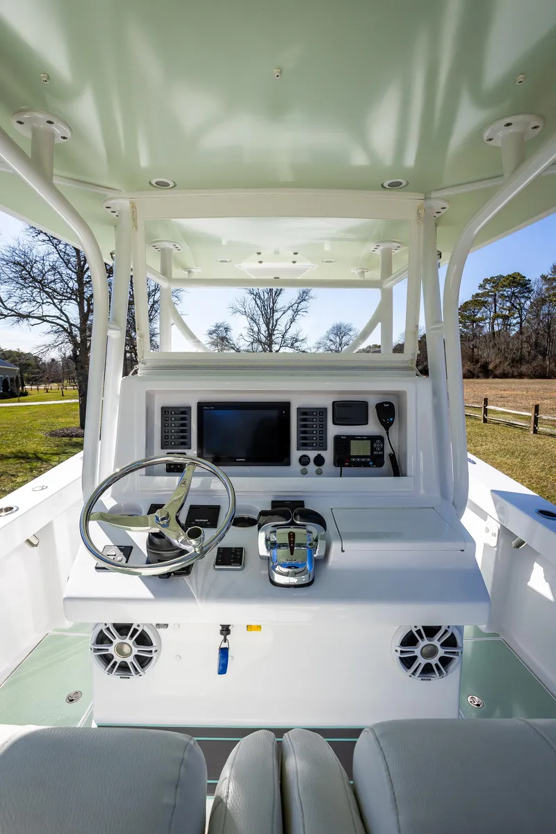 Slide: The Image of 2005 French Yachts 34 Center Console helm with modern navigation equipment and controls. - 3