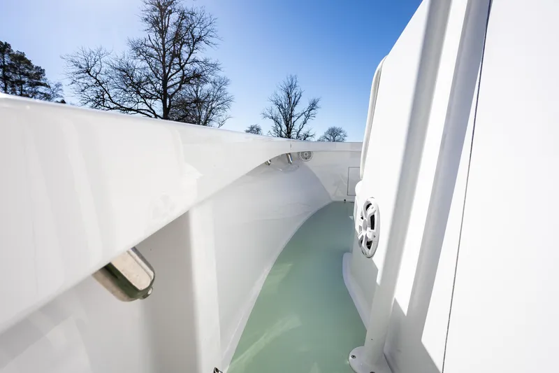 Slide: The Image of 2005 French Yachts 34 Center Console, sleek white deck, clear sky background. - 30