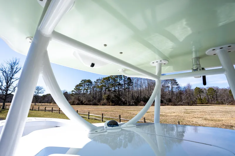 Slide: The Image of 2005 French Yachts 34 Center Console, view of structure and countryside background. - 31